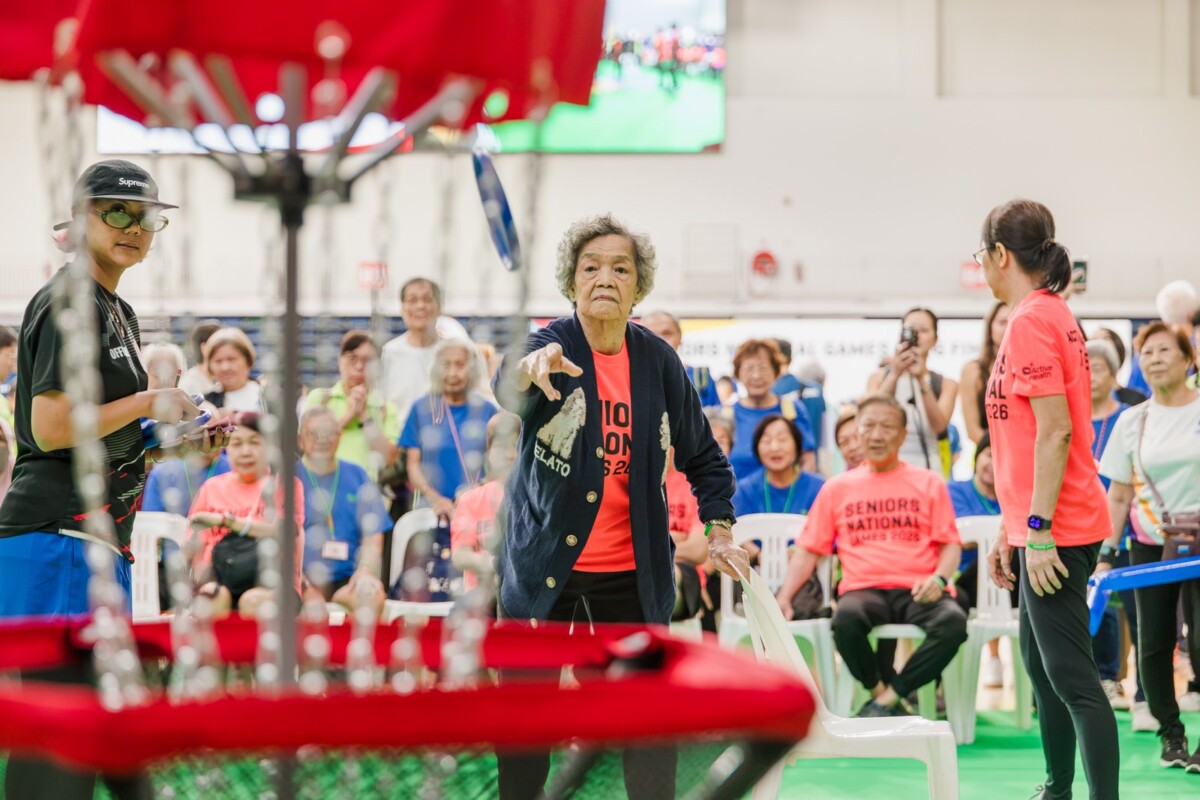 A participant takes aim during a target sport at the Seniors National Games 2026. Image: Sport Singapore