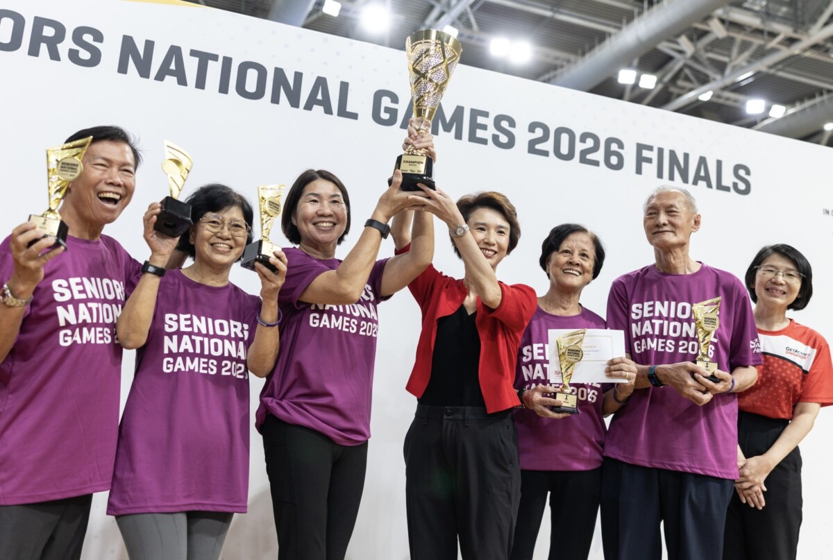 Guest-of-Honour Ms Low Yen Ling celebrates with a winning team at the Seniors National Games 2026 Finals. Image: Sport Singapore