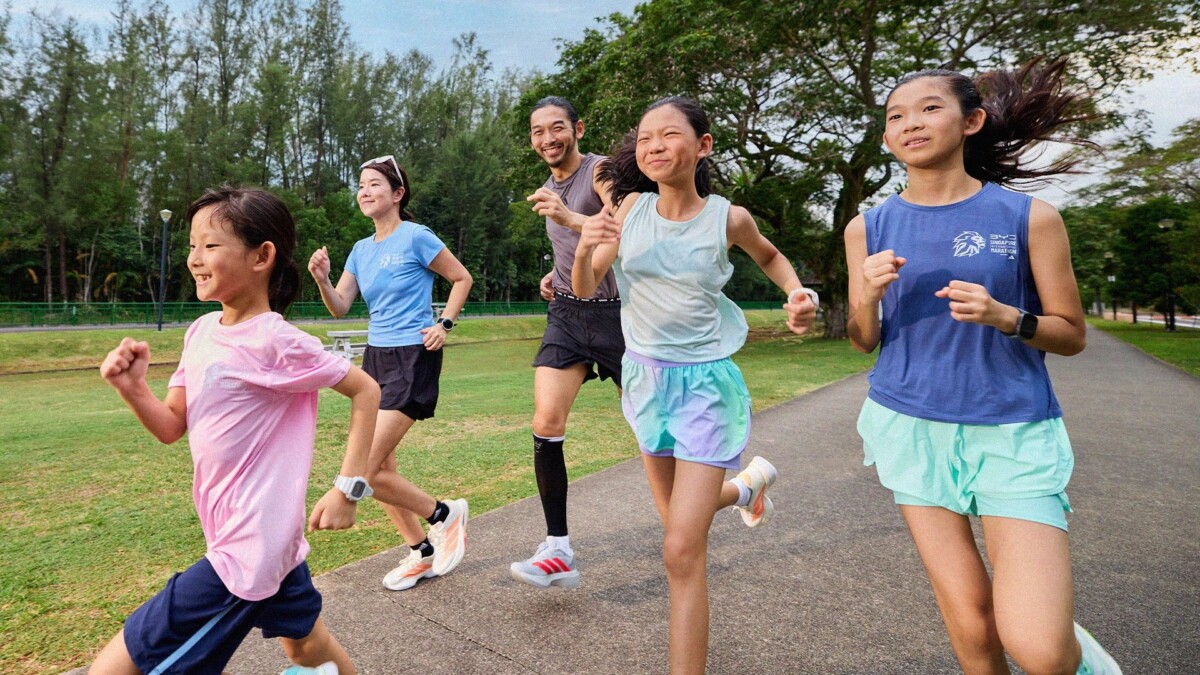 A family running together outdoors