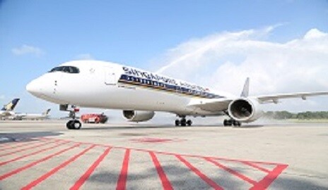 Singapore Airlines Airbus A350 on the apron under a water cannon arch