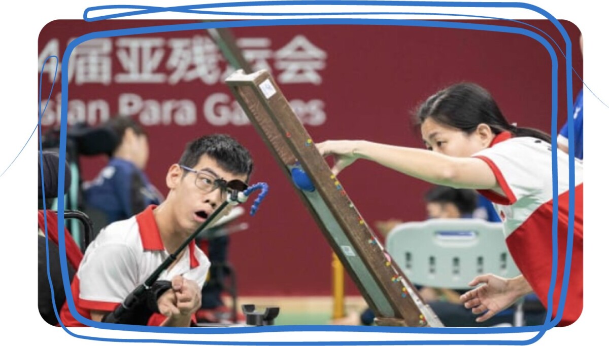 Singapore boccia athlete uses a head pointer and ramp at the Asian Para Games