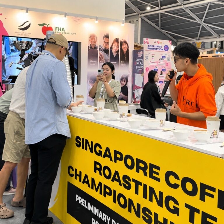 Competitors and judges cupping coffee at the Singapore Coffee Roasting Team Championship counter