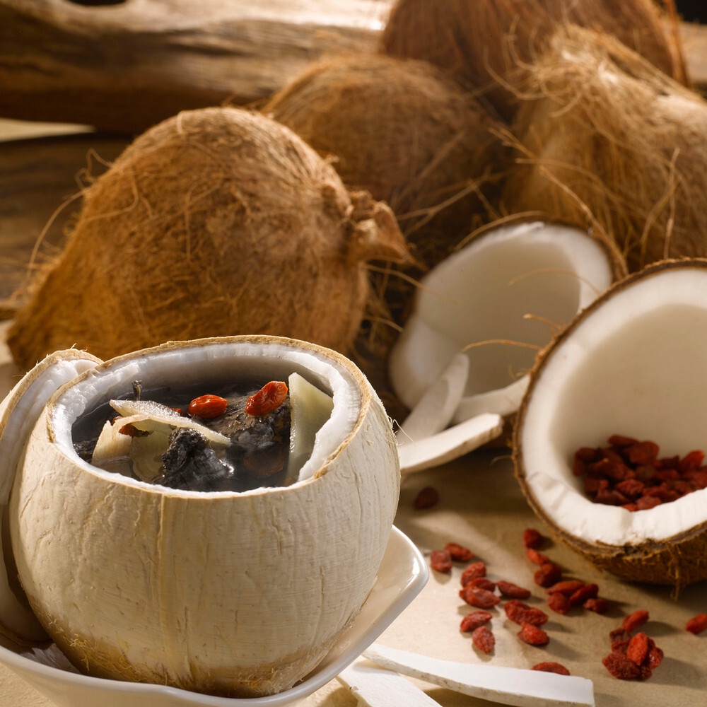 Soup Restaurant double-boiled soup served in young coconut