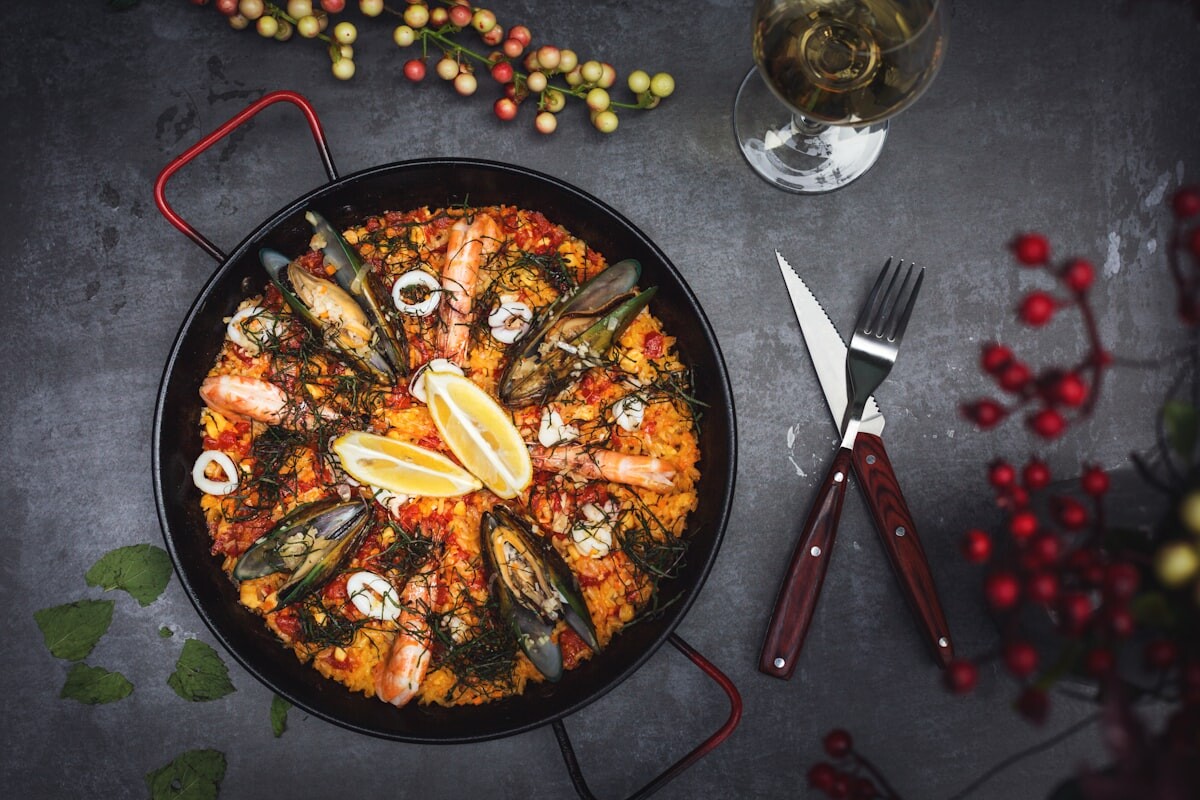A traditional Spanish paella with seafood and saffron rice