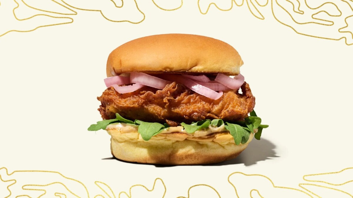 Shake Shack White Truffle Chicken burger with crispy chicken, arugula and pickled shallot on a potato bun