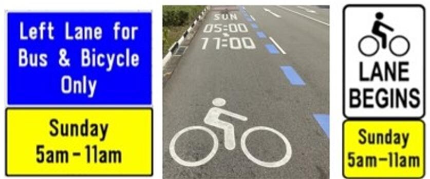 Road signs reading Left Lane for Bus and Bicycle Only, Sunday 5am to 11am, and a bicycle lane marking on the road