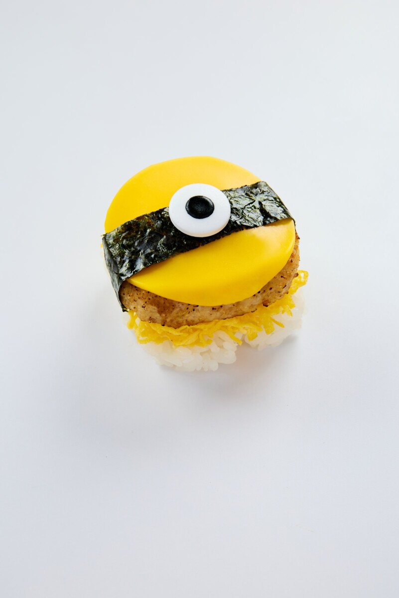 Sushi Express x Minions & Monsters Chicken Hamburg Steak with Minion-themed presentation