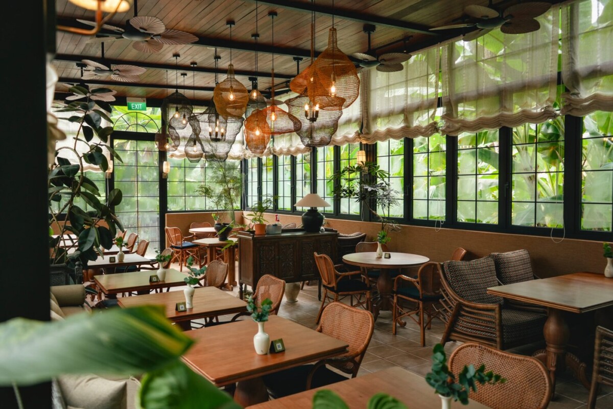 Tembusu dining room at Singapore Botanic Gardens Ginger Garden with rattan chairs and tall windows