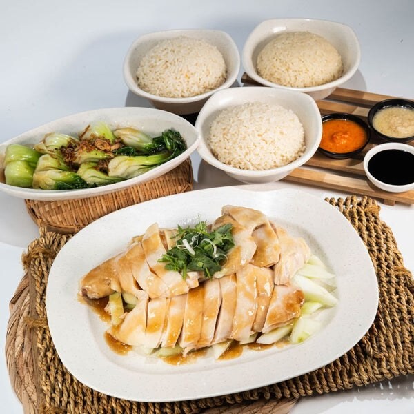 Plate of Tian Tian Hainanese chicken rice with chilli and dark sauce