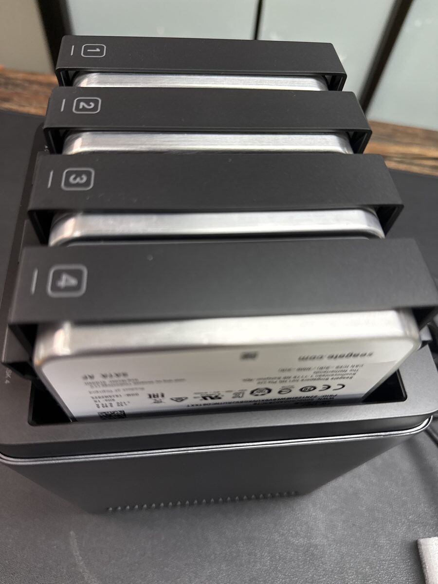 All four bays of the UGREEN NASync DH4300 Plus loaded with drives