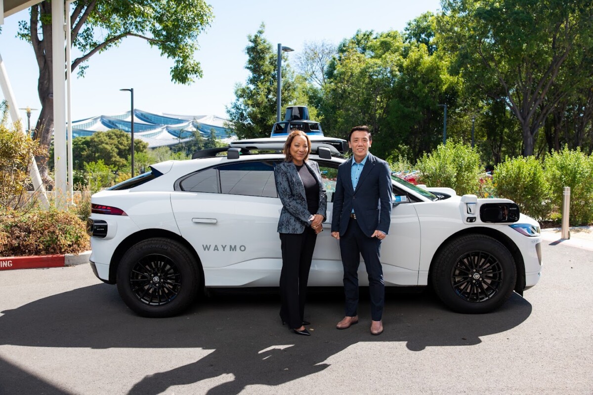 Waymo co-CEO Tekedra Mawakana with Transport Minister Jeffrey Siow