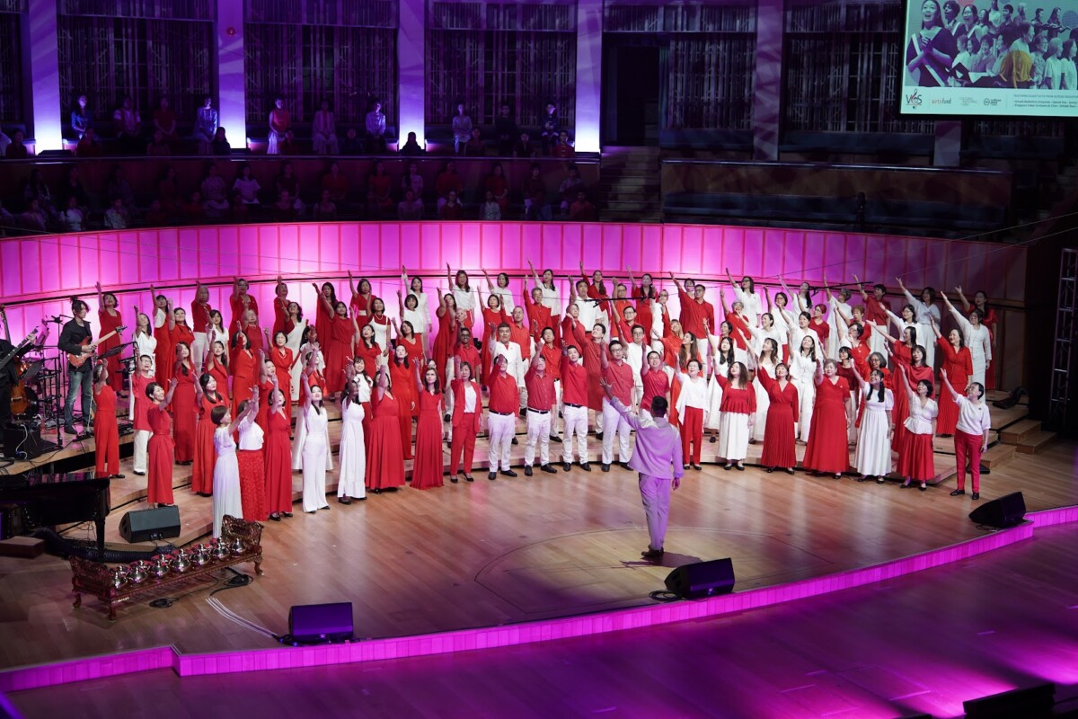 VOS choral society members performing on stage