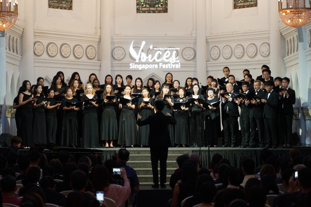 Choir and conductor performing at the Voices of Singapore Festival
