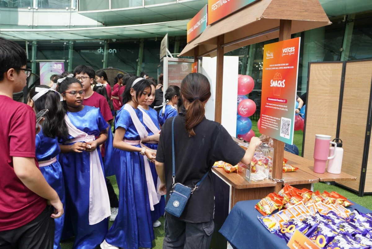 Festival-goers at a Voices of Singapore Festival community booth