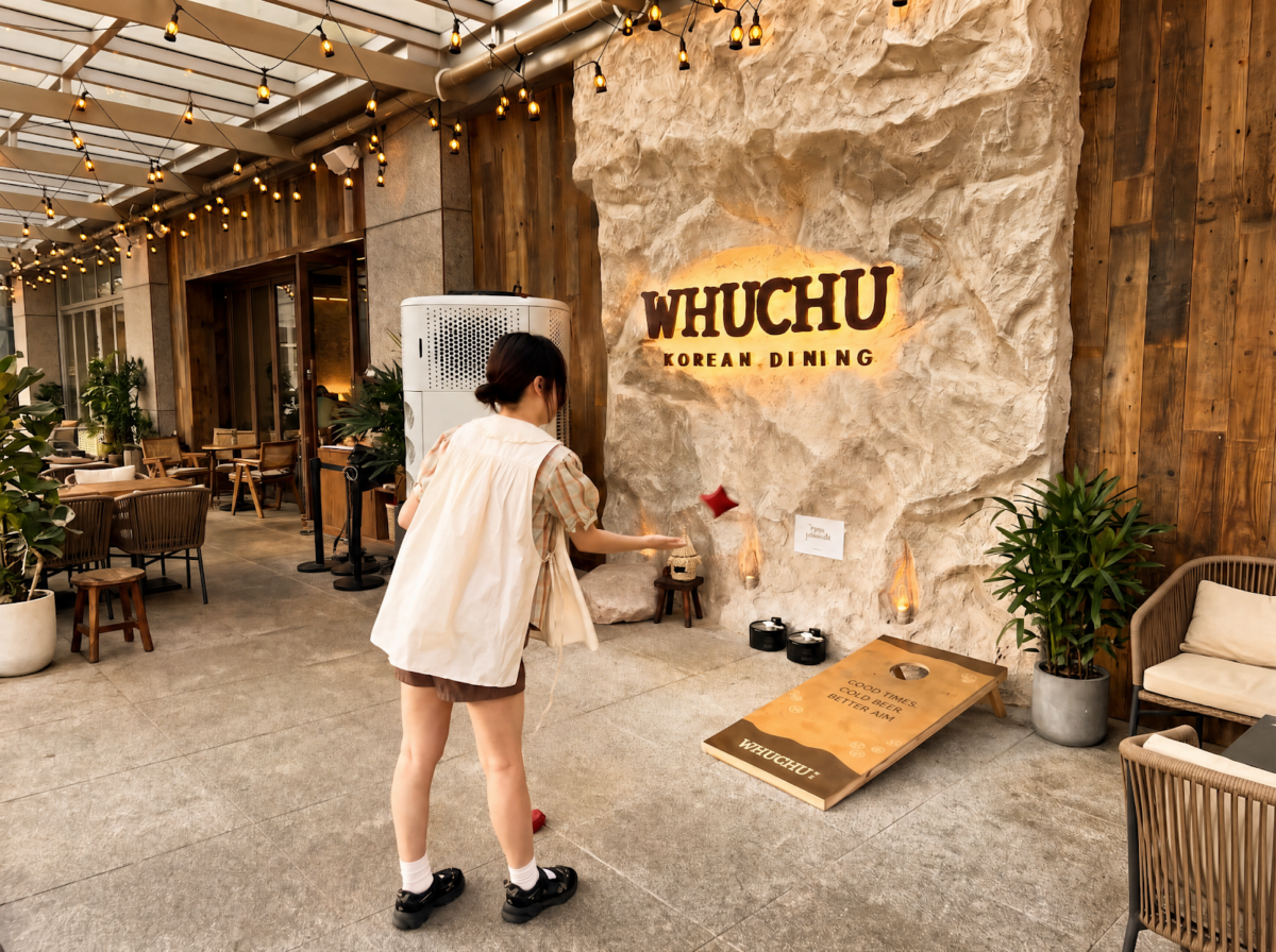 Lawn games at WHUCHU Beer Garden, including cornhole and giant noughts and crosses.