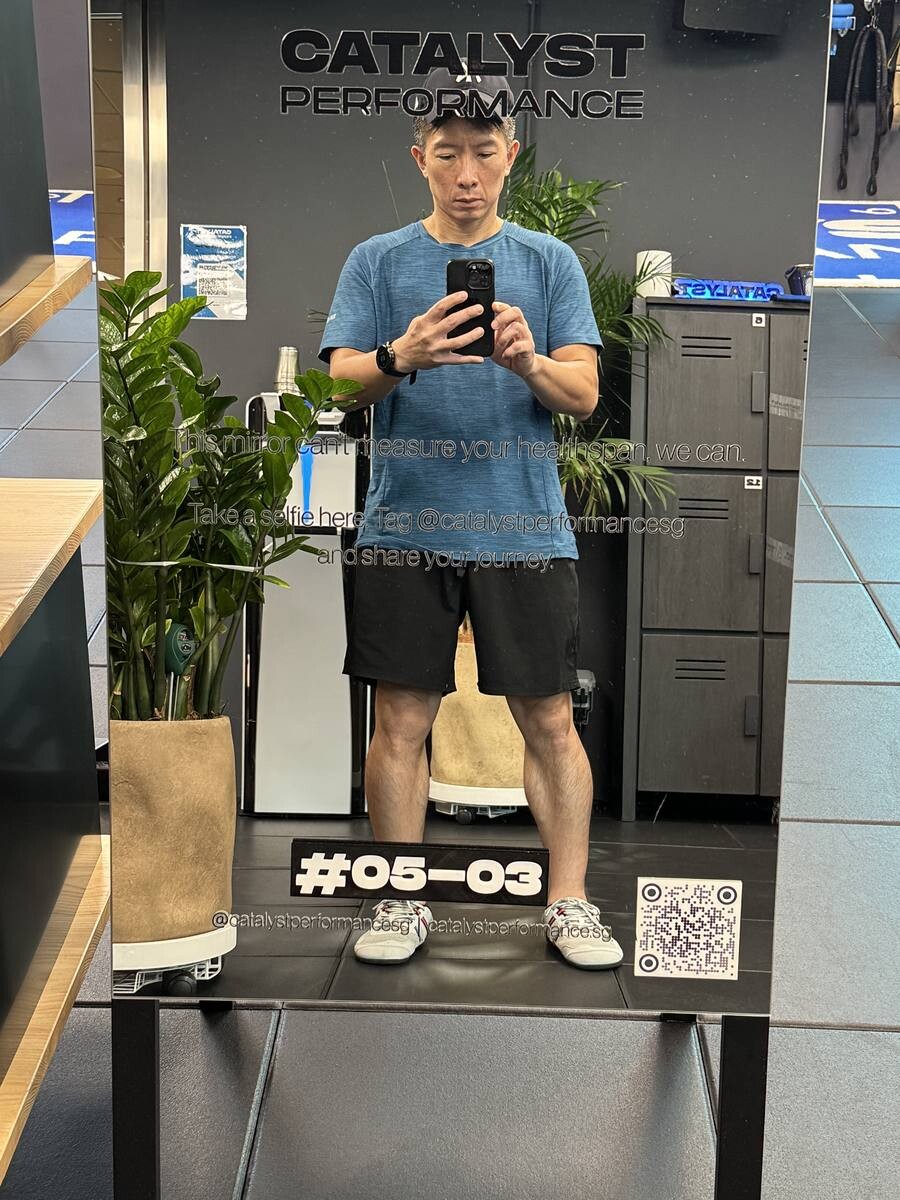 Willie Tan taking a selfie at Catalyst Performance mirror at Manulife Tower unit 05-03