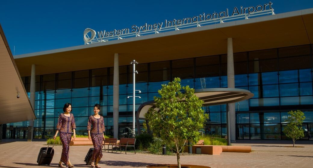 Singapore Airlines cabin crew outside the Western Sydney International Airport terminal